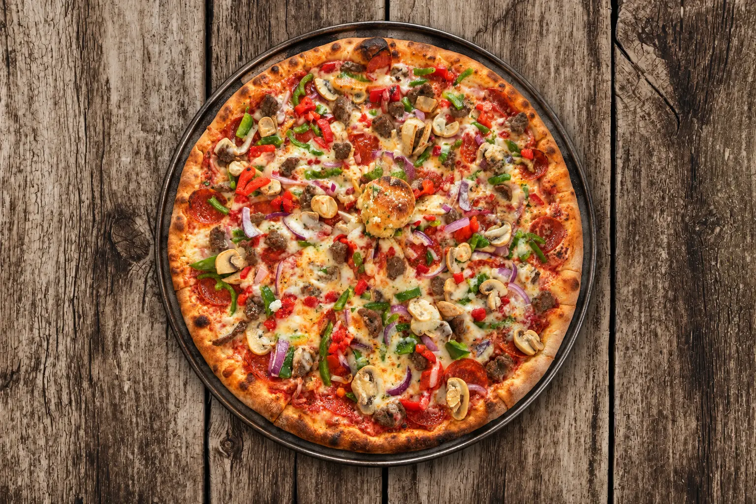 Specialty pizza on a pan from Spanky's Pizza & Subs