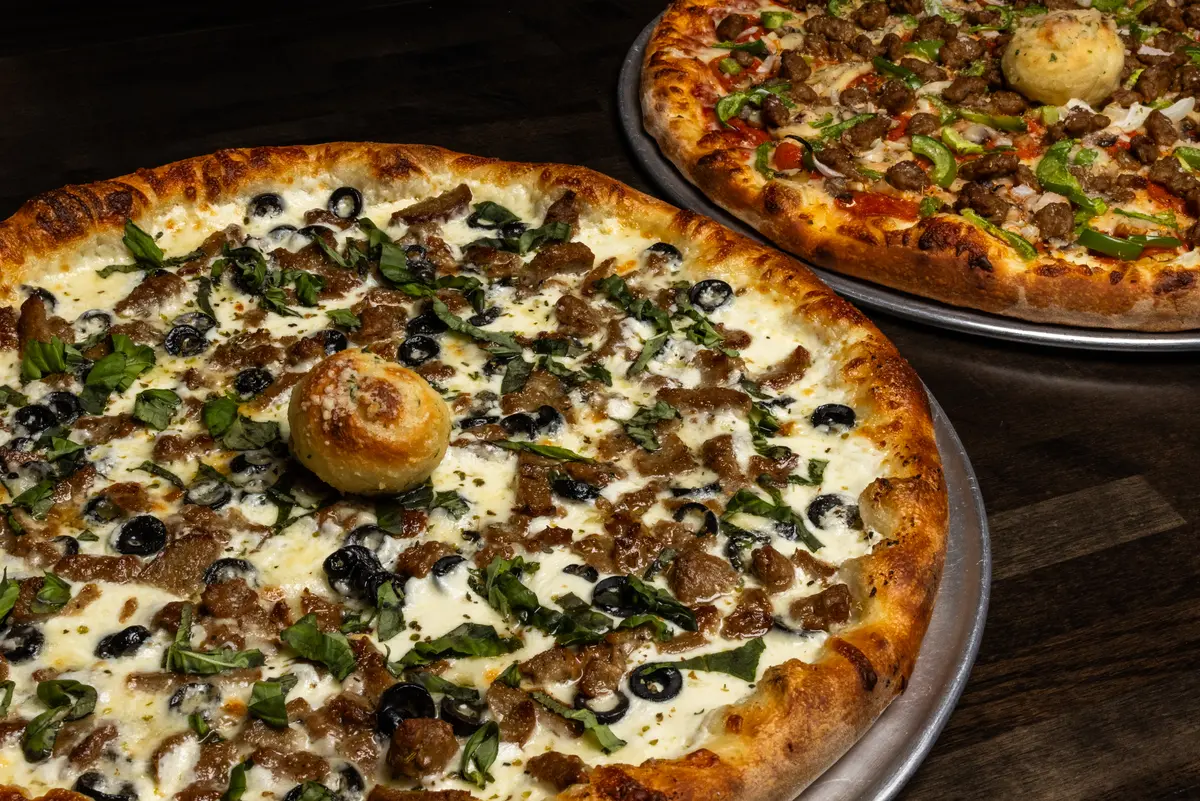 Two specialty pizzas from Spanky's Pizza & Subs